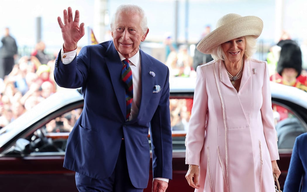 Britain's King Charles III and Britain's Queen Camilla arrive to meet members of the Welsh Parliament during a visit to commemorate the 25th anniversary of the Senedd, in Cardiff on July 11, 2024.