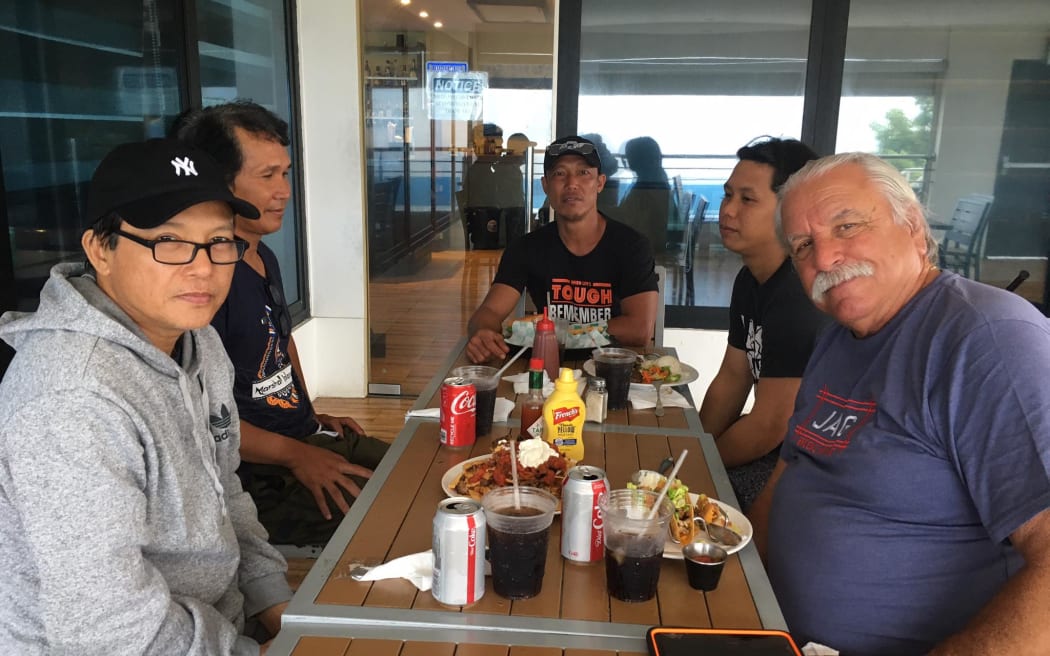 Yap Seagull Captain, American Jim Santos, right, got his crew off the fishing vessel just minutes before it sank in heavy seas off Majuro on Friday. He is pictured here with some of his crew having a meal at the Toeak Bar & Grill in Majuro the day after the vessel sank.