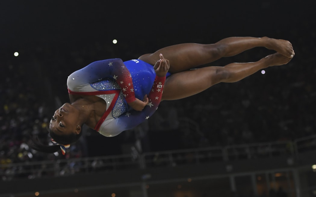 US gymnast Simone Biles competes in the women's floor event final of the Artistic Gymnastics at the Olympic Arena during the Rio 2016 Olympic Games in Rio de Janeiro on August 16, 2016.