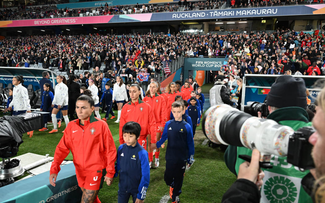 Players arrive on the field prior to the Australia and New Zealand 2023 Women's World Cup Group E football match between Portugal and the United States at Eden Park in Auckland on 1 August, 2023.