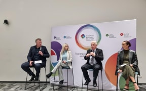 Tauranga's mayoral candidates at the debate. Sitting from left to right:  Mahe Drysdale, Tina Salisbury, Greg Brownless, and Ria Hall.