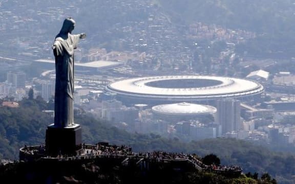 The statute of Christ the Redeemer stands above Rio.