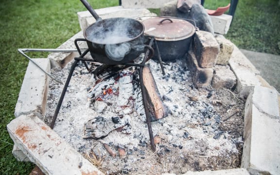 A fire pit Gary Melville built out of fallen bricks from his quake damaged home.