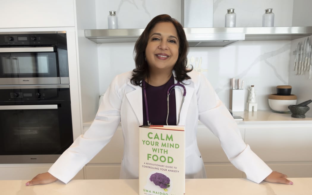 Dr Uma Naido with her book, Calm Your Mind with Food