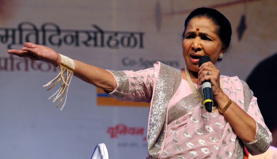 Indian Bollywood playback singer Asha Bhosle performs at The ‘25 Master Deenanath Mangeshkar Awards’ in Mumbai late April 25, 2014.