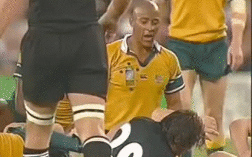 An animated gif of former Australian captain George Gregan taunting the 2003 All Blacks with the comment ""four more years".