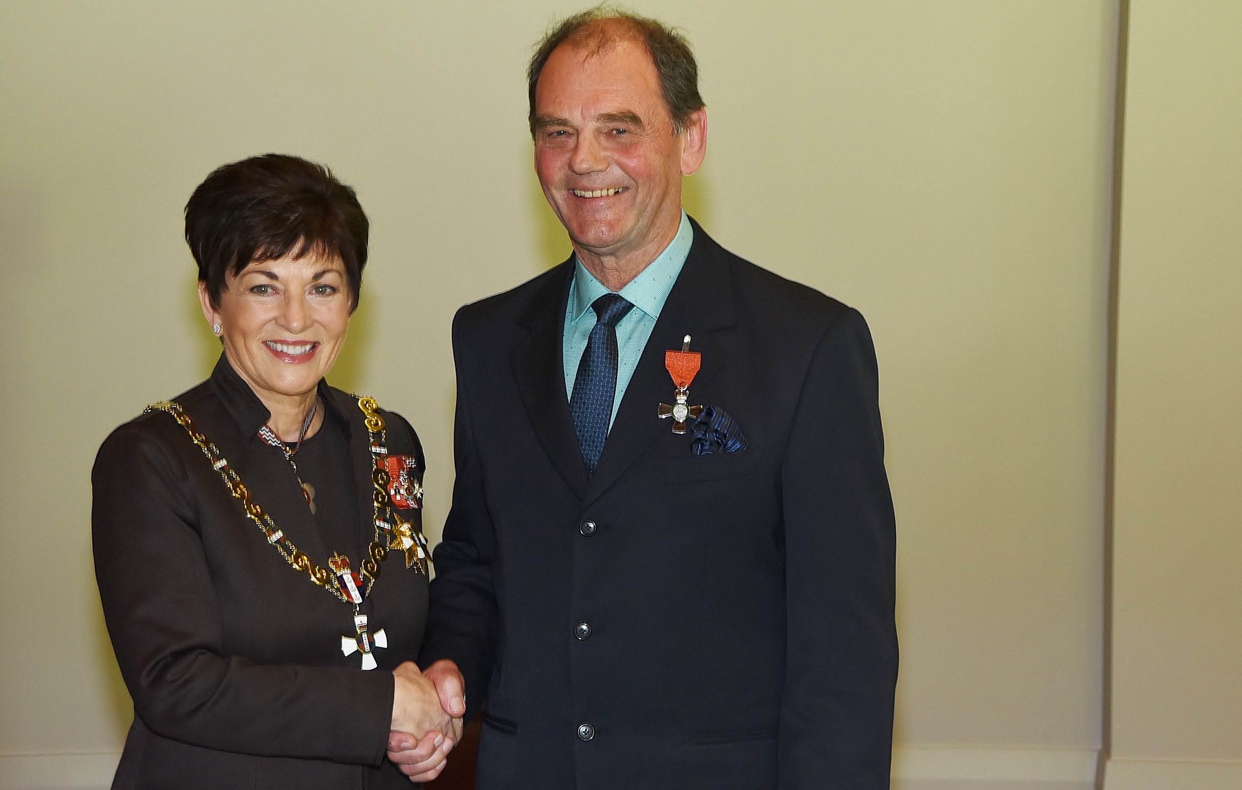 John Ure receiving his MNZM for services to music from Dame Patsy Reddy in 2016