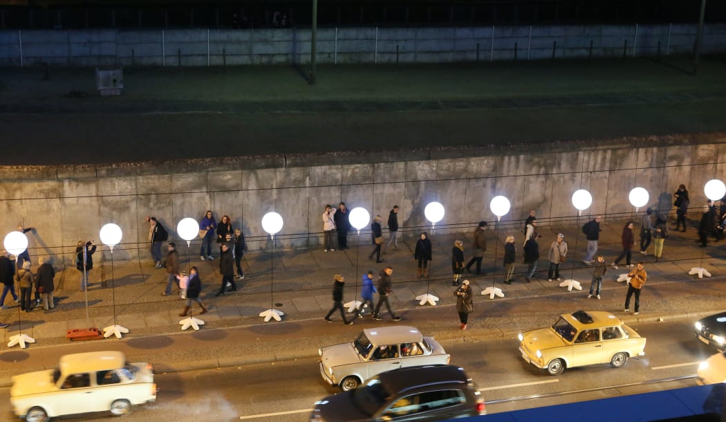 Balloon lanterns mark a Berlin Wall memorial site on Bernauer Street.
