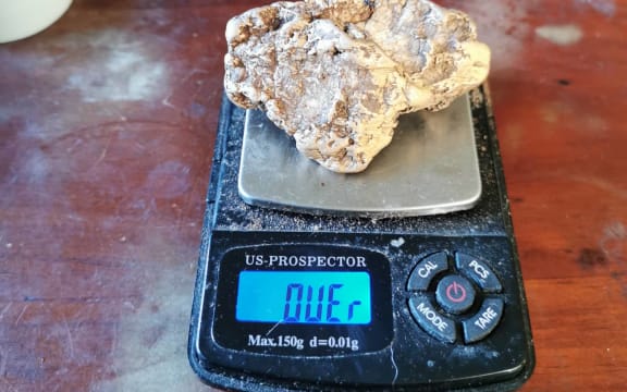 Craig Douglas' gold nugget on scales.