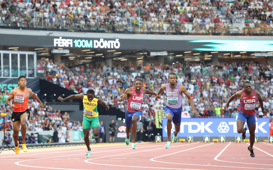 Noah Lyles of United States (C) wins the men's 100m final of the 2023 World Athletics Championships in Budapest.