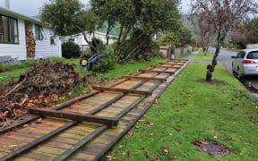 A fence in Waikanae that was levelled by a suspected tornado on 9 June 2022.