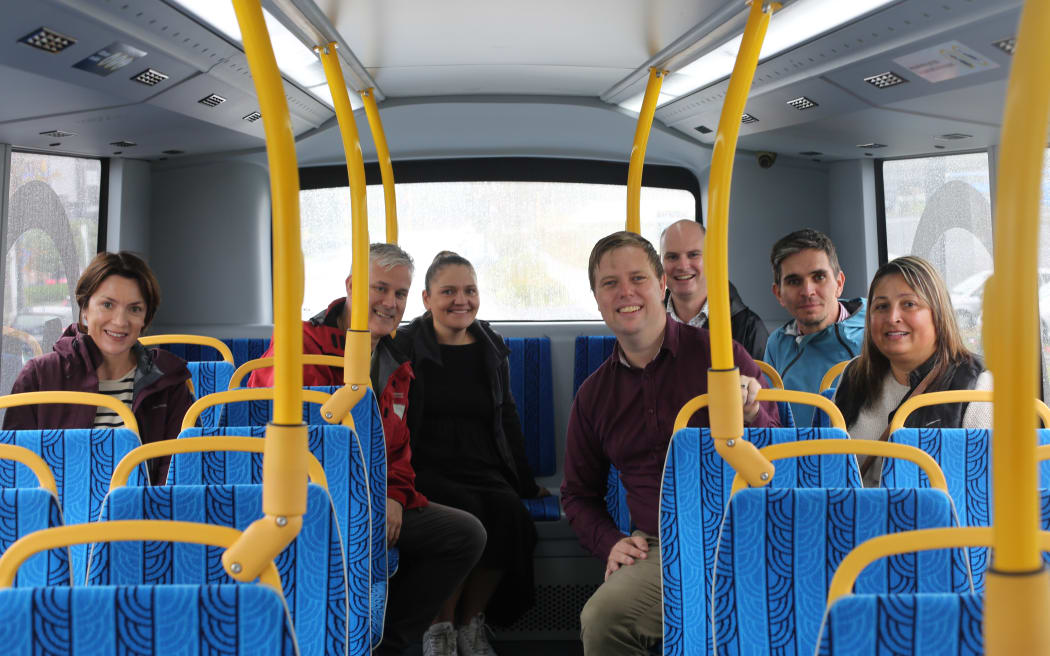 Waitākere Councillor Shane Henderson on an electric double-decker bus.