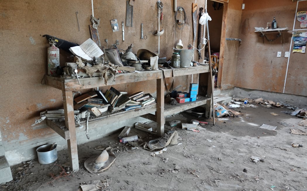 The remaining, silt-ridden belongings in the Greenes' garage.