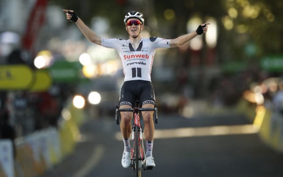 Stage winner Team Sunweb rider Denmark's Soren Kragh Andersen celebrates as he crosses the finish line at the end of the 14th stage of the 107th edition of the Tour de France.