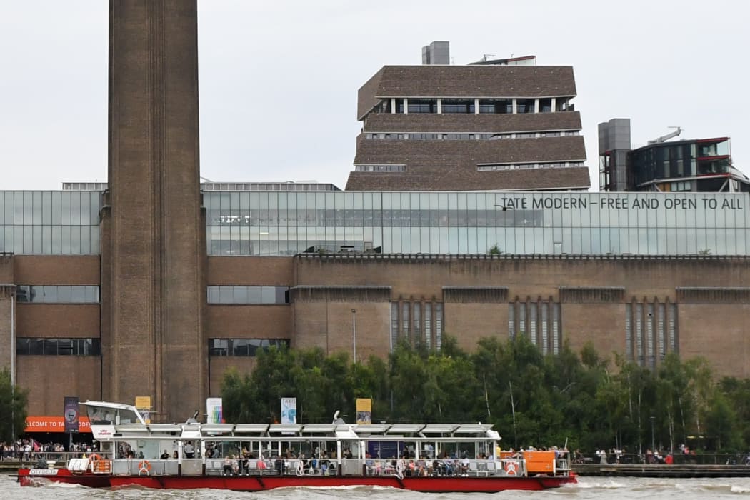 The viewing gallery at the Tate Modern rises above and behind the main building, centre,