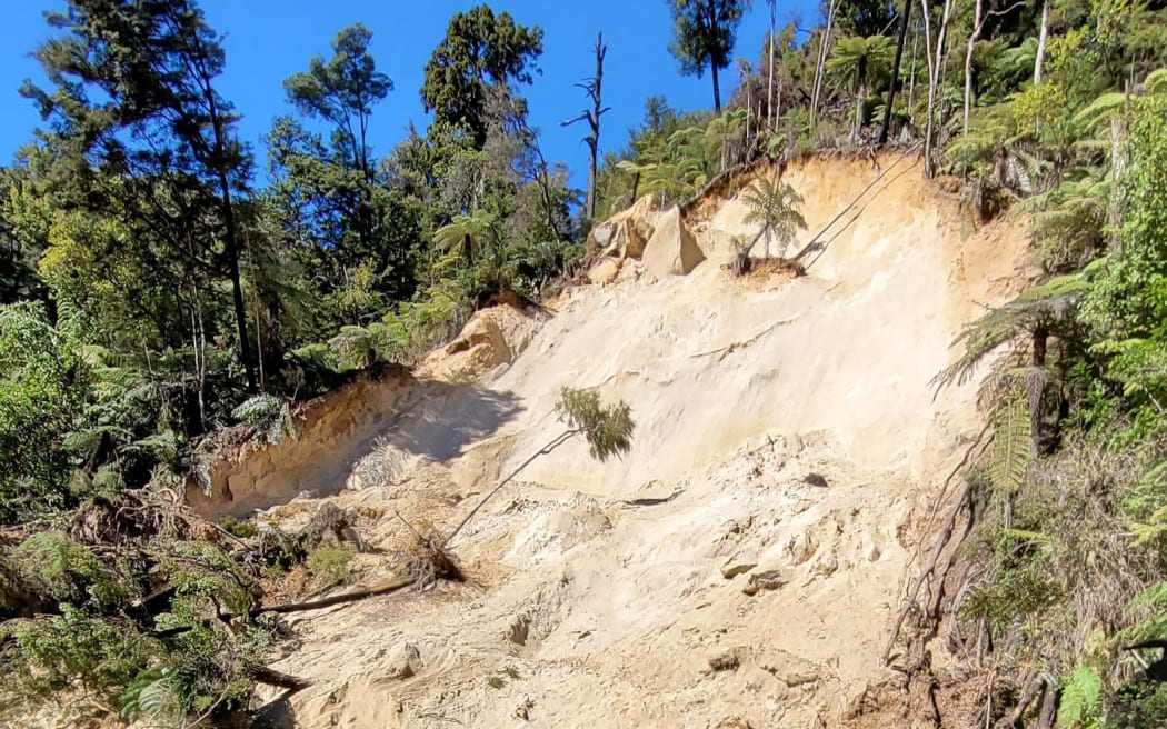 A slip by Torrent River Bridge on the Abel Tasman coastal track.