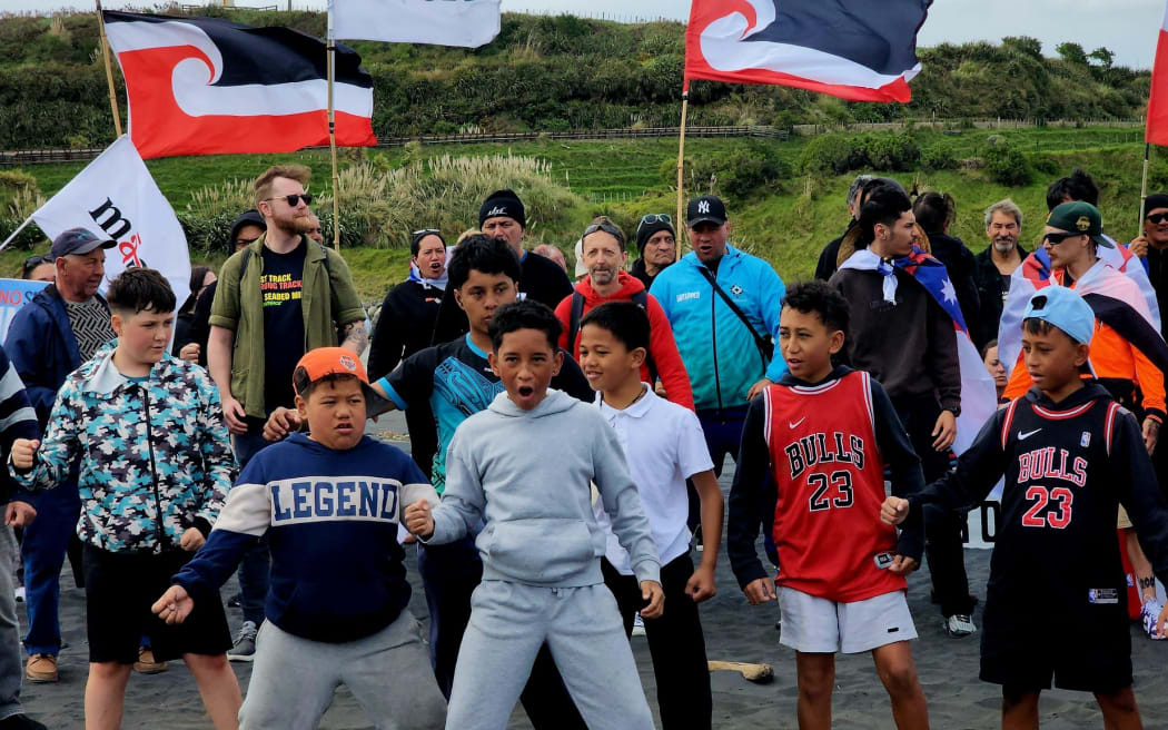 People marching through Patea in a hīkoi to oppose seabed mining, on 2 October, 2024.