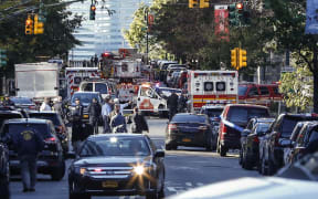 Emergency personal respond after reports of multiple people hit by a truck after it plowed through a bike path in lower Manhattan on October 31, 2017 in New York City.