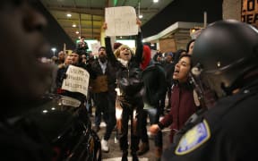 JANUARY 28: Police members intervene and arrest some of activists during the protest against President Donald Trump's 90-days ban of entry on 7 Muslim-majority countries in the Fourth terminal of JFK airport in New York, U.S.A