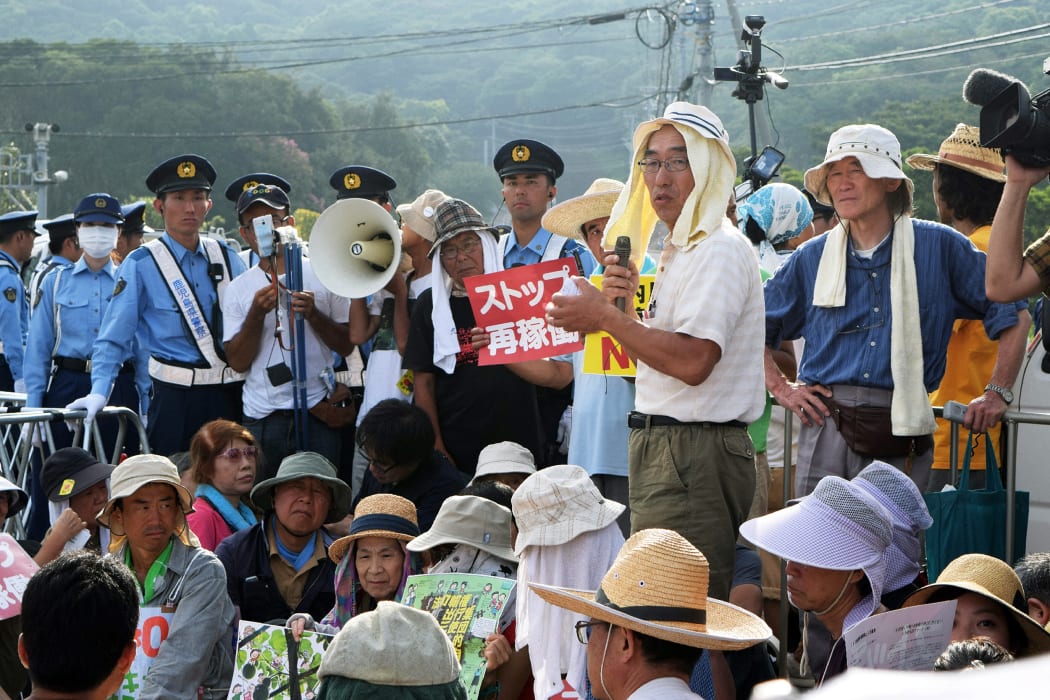 People stage a rally against the restarting of the nuclear reactor in Sendai.