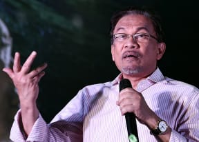 Malaysian opposition leader Anwar Ibrahim addresses supporters at a gathering in Kuala Lumpur on 9 February.