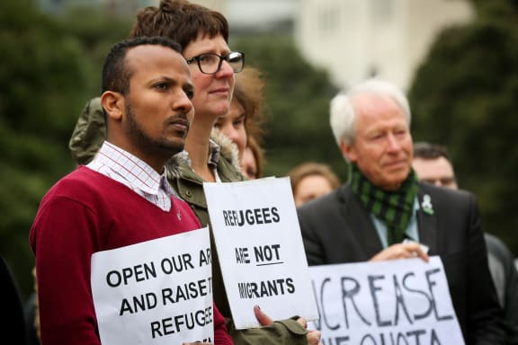 Protesters gather at Parliament for the Government to increase the refugee quota.