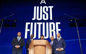 Activist Korey Wise (C) speaks on stage as representatives from “the Central Park Five,” (L-R) Activist Kevin Richardson, New York City Council Member Dr. Yusef Salaam, and Activist Raymond Santana, along with Rev. Al Sharpton (2nd-R) look on during the final day of the Democratic National Convention at the United Center on August 22, 2024 in Chicago, Illinois.