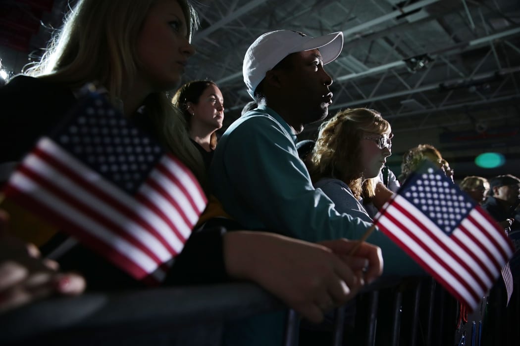 Supporters listen to Democratic presidential candidate Bernie Sanders during a campaign event at Grand View University in Des Moines, Iowa on 31 January 2016.