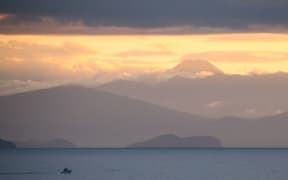 Lake Taupo fills the massive caldera of the Taupo supervolcano, and is flanked by further volcanoes such as Ngauruhoe.
