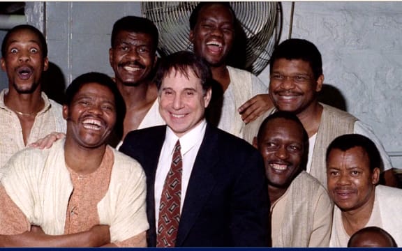 Joseph Shabalala, front left with members of Ladysmith Black Mambazo and Paul Simon