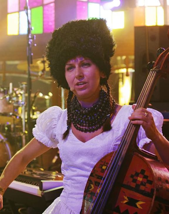 Nina Garenetska and her cello painted with traditional Ukrainian folk motifs