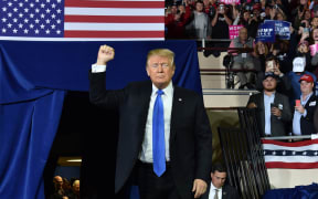 US President Donald Trump arrives to a "Make America Great Again" rally at the Eastern Kentucky University, in Richmond, Kentucky, on October 13, 2018. (Photo by Nicholas Kamm / AFP)