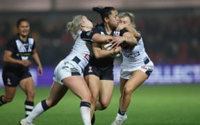 New Zealand's Abigail Roache in action with England's Tara Jane Stanley and Georgia Roche - England Women v NZ Kiwi Ferns, Semi Final match of the Rugby League World Cup 2021 (played in 2022) at the LNER Community Stadium, York, England on Monday 14 November 2022. © Mandatory credit: John Clifton / www.photosport.nz