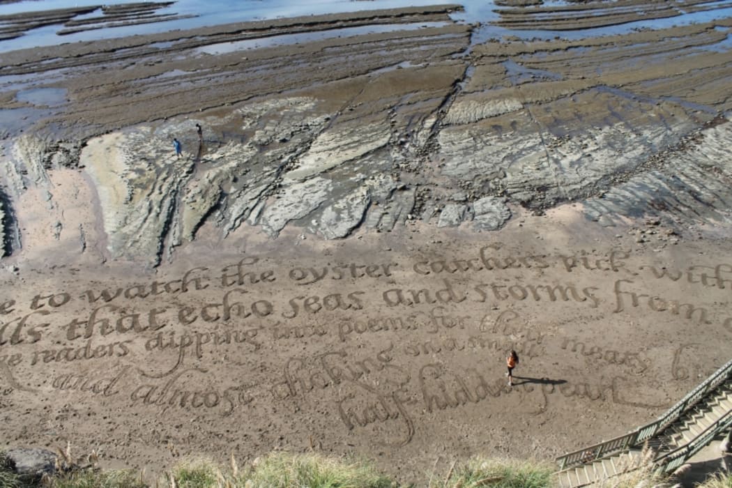 A view of the completed poem from the cliff top above.