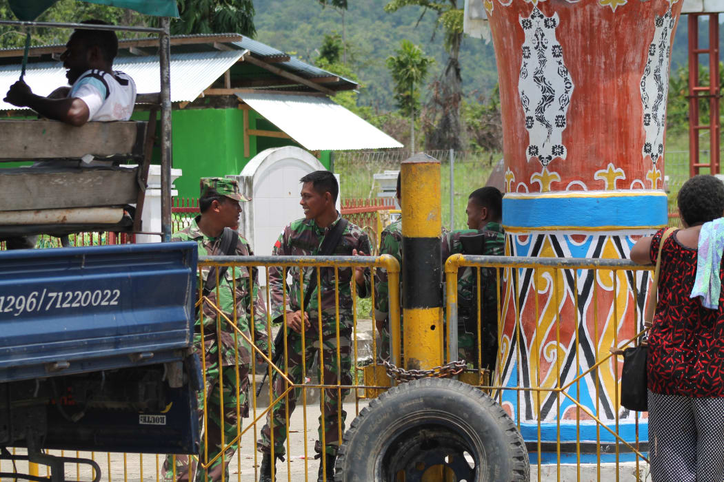 Indonesian soldiers man the border with Papua New Guinea at Wutung.