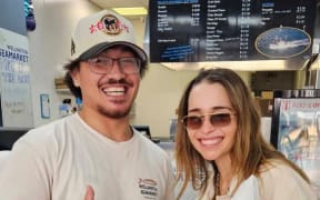 British actress Emilia Clarke at the Wellington Seafood Market in Lambton Quay, with T.