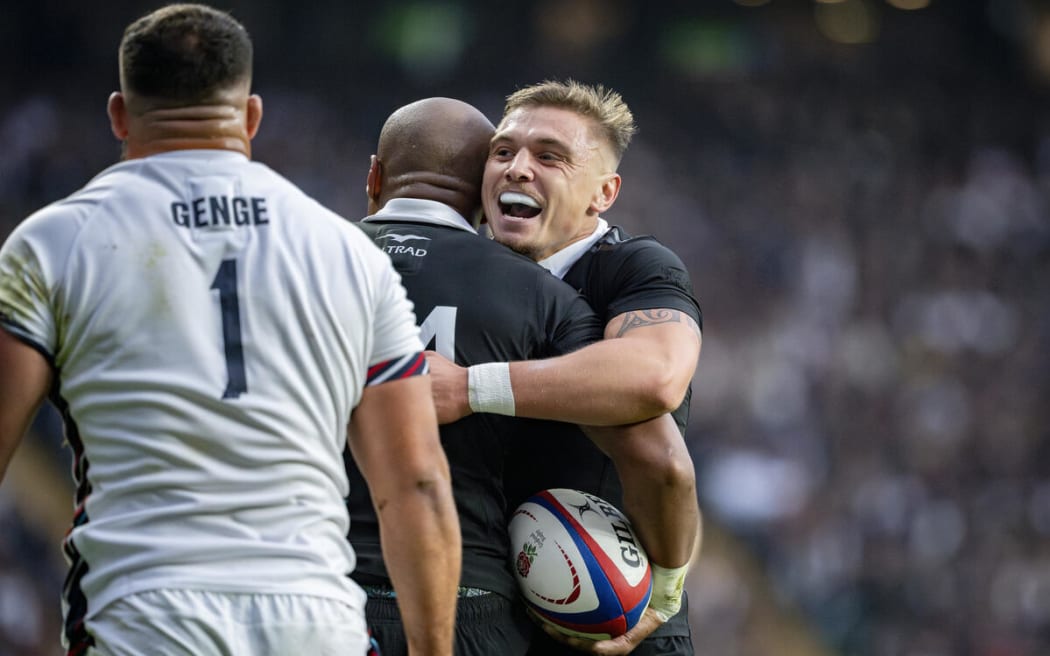 All Black Cortez Ratima celebrates with All Black Mark Tele'a after Mark Tele'a scores the opening try during All Blacks v England test.