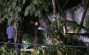 Officials along with police personnel conduct a search operation after an alleged explosion occured near the embassy in New Delhi on December 26, 2023. Indian police were investigating reports of a blast near the Israeli embassy in New Delhi on December 26, that did not cause any casualties. (Photo by Arun SANKAR / AFP)
