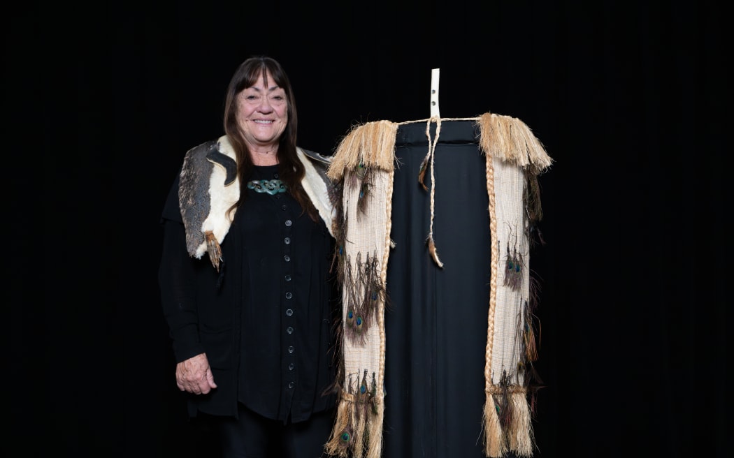 Rokahurihia Ngarimu-Cameron with one her works at Te Whare Pora