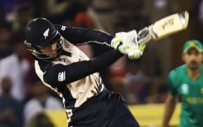 The Black Caps opener Martin Guptill hits a boundary against Pakistan.