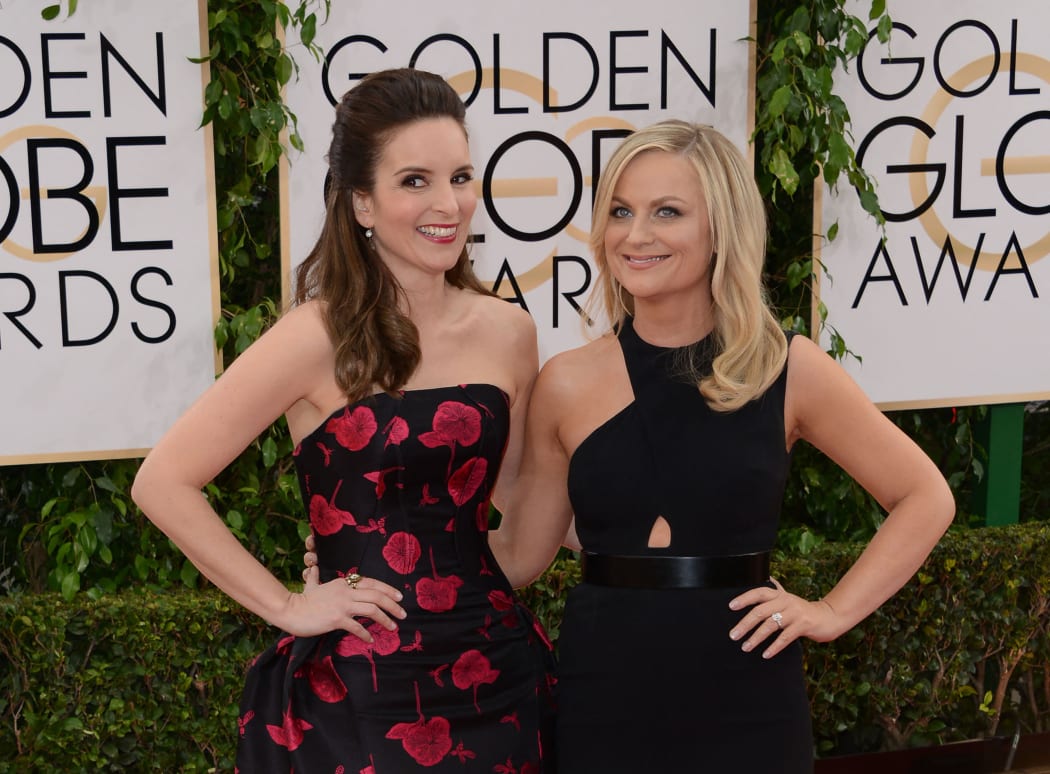 Tina Fey (left) and Amy Poehler are returning to hosting duties this year.