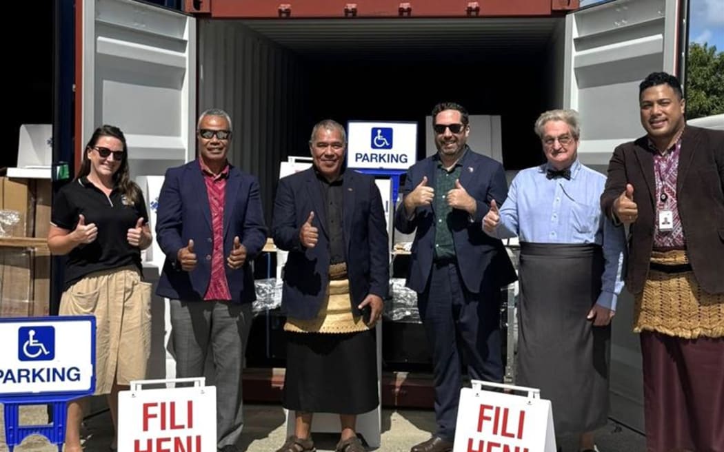 Tonga's Supervisor of Election Pita Vuki (third from left), New Zealand High Commissioner Matthew Howell (third from right) and Tonga Electoral Commission chairman Lord Dalgety K.C (second from right) with the New Zealand government's assistance. Photo: Tonga Electoral Commission.