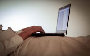Person watching porn on laptop computer.