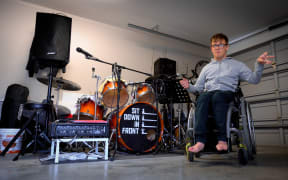Cory Newman in his band practice space