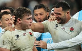 England’s Theo Dan celebrates scoring their second try with teammates in the thrid-place play-off against Argentina.