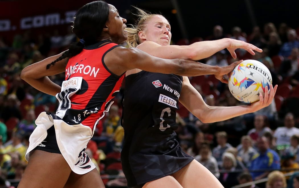 aura Langman of New Zealand is challenged by Amanda Cameron of Trinidad & Tobago.