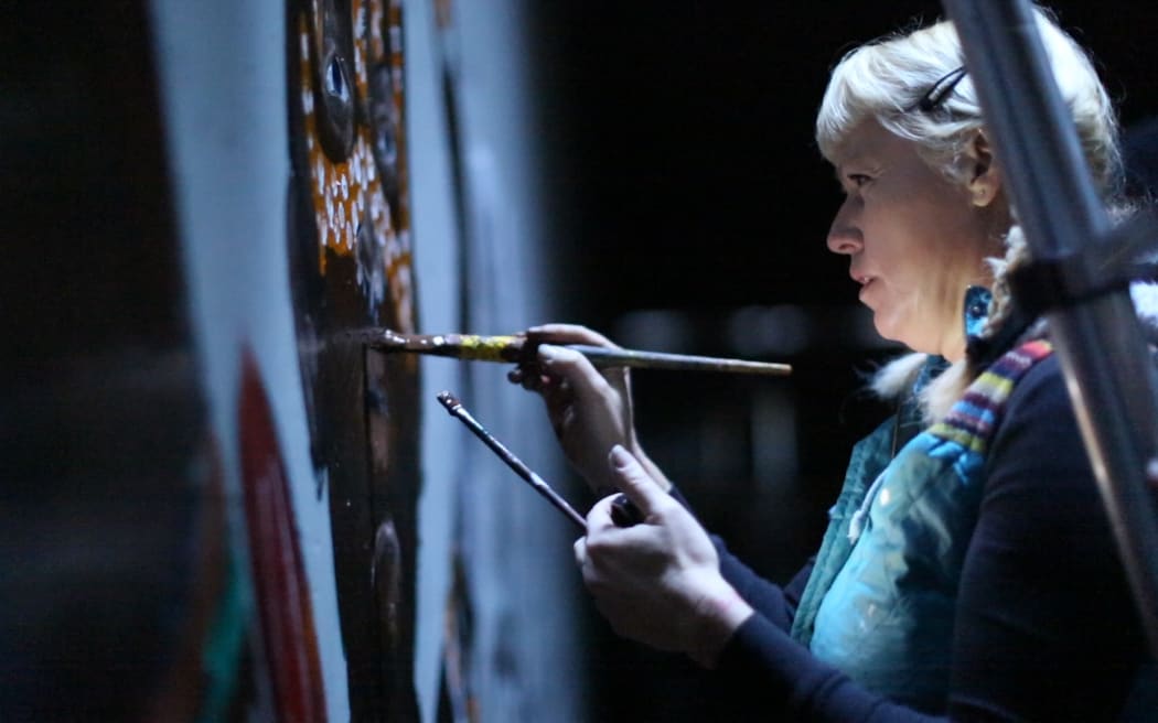 Lydia Early painting in tunnel
