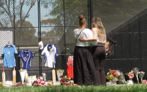 Mourners gathered to leave tributes at the cricket nets following news of Ben Austin's death.