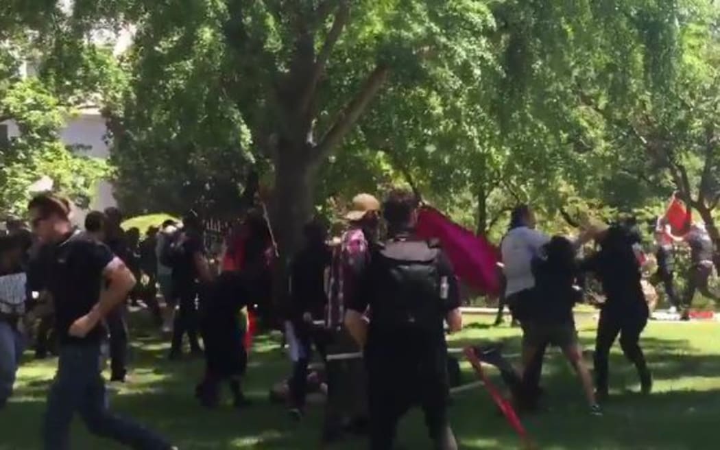 Clashes between competing groups at a rally by white nationalists in California.