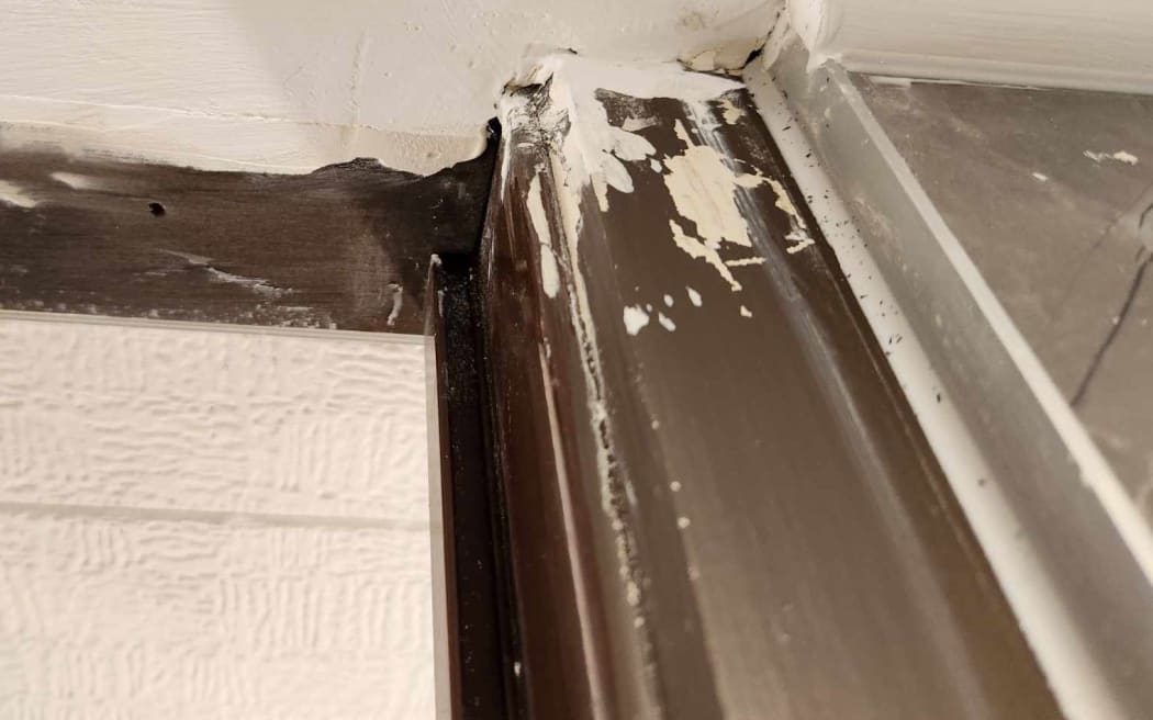 White paint can be seen splashed across a wall.